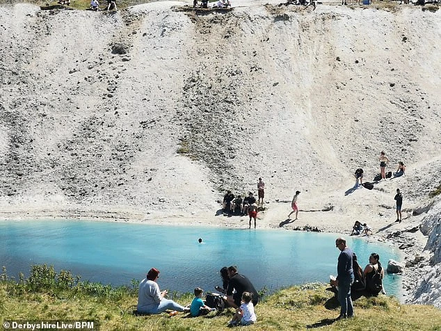 The flooded lime pool, once the site of an industrial kiln that towered over Harpur Hill, near Buxton in the Peak District, was the source of huge problems for locals last year as thousands of people have been drawn to the vivid blue hue of the water