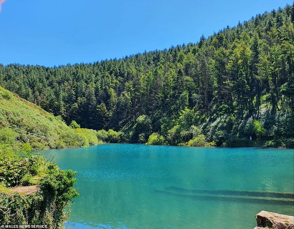The beautiful valley lake, known as the 'Blue Lagoon', is a private reservoir that has become popular among Instagrammers because of its magnificent turquoise hues.
