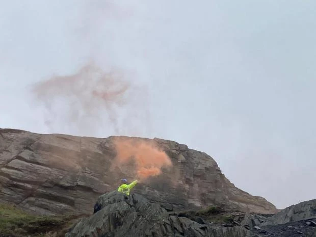 Tivyside announcer: A flare is lit to help the Coastguard Rescue Helicopter land on the plateau