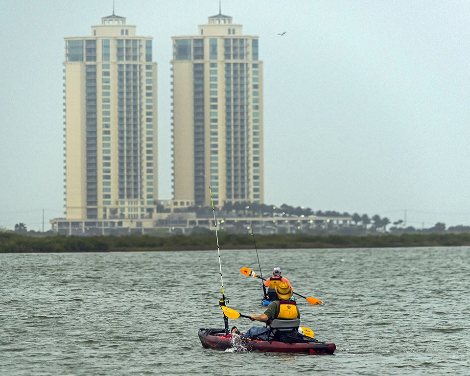 Fisherman in kayak at East End Lagoon