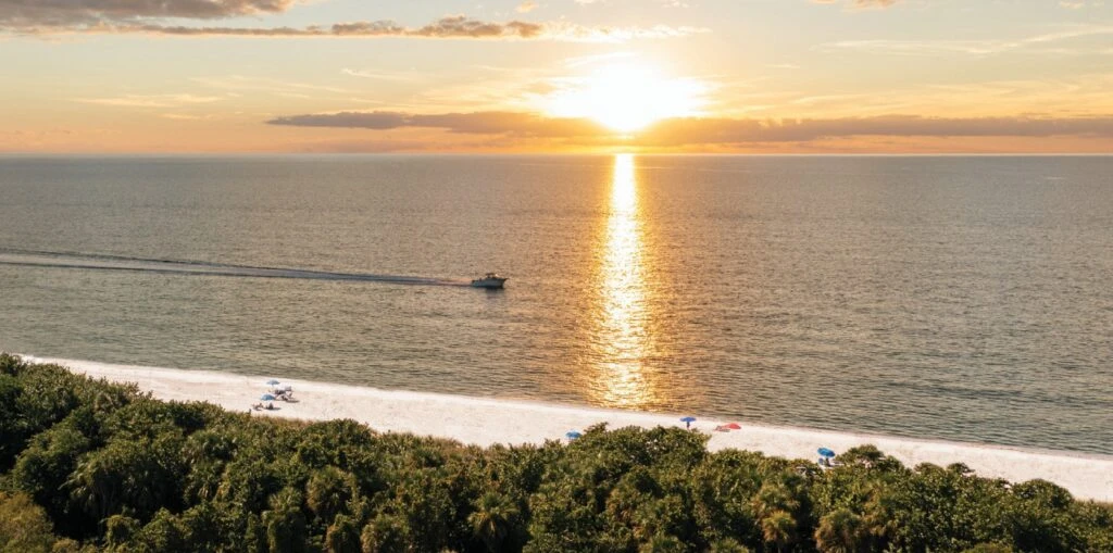 Below Boating on the Gulf of Mexico One Naples enjoys an enviable location on the Gulf of Mexico, which is directly across from the community.
